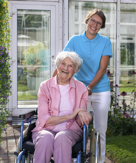 caregiver with wheelchair bound woman
