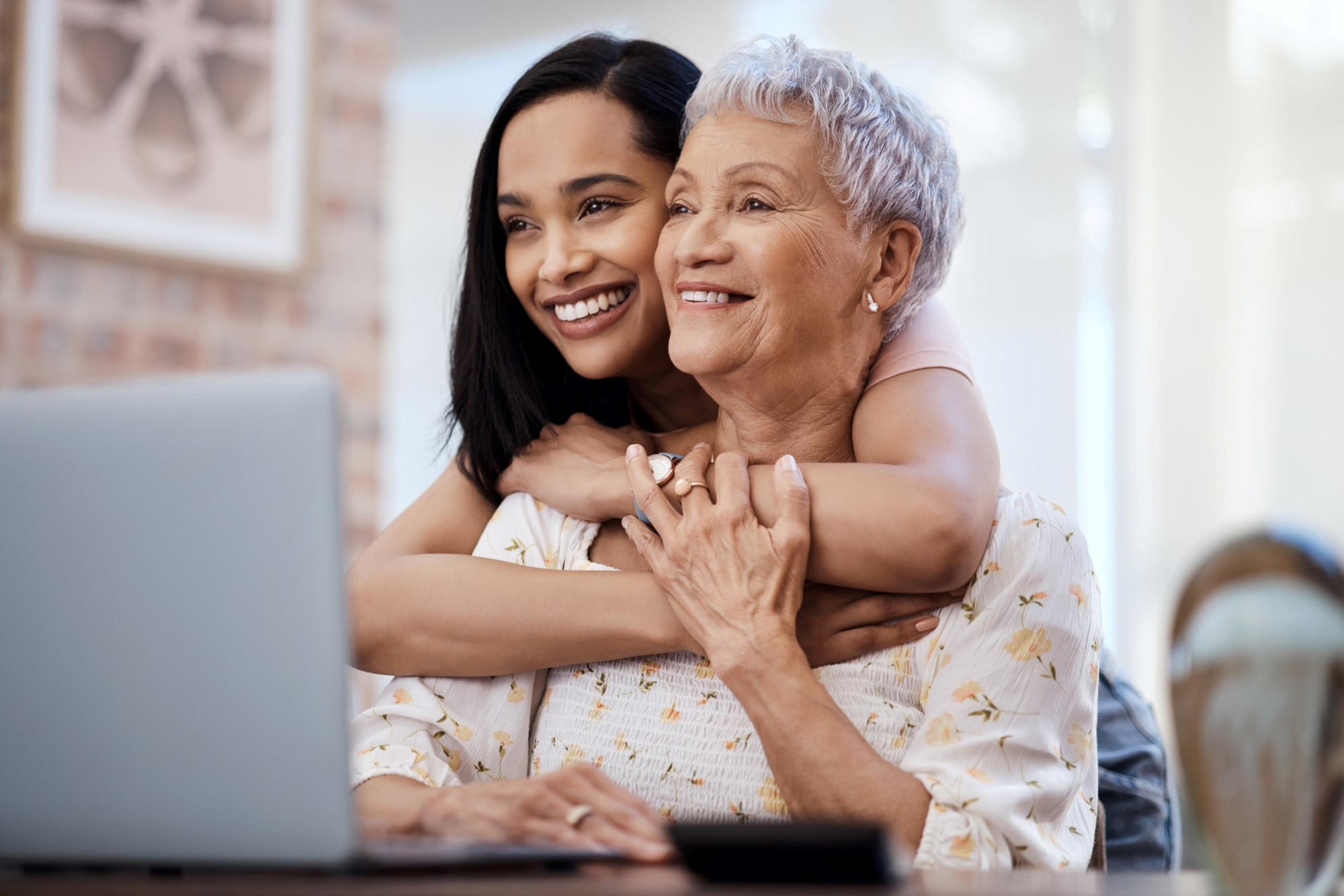 woman and her elderly mother smiling